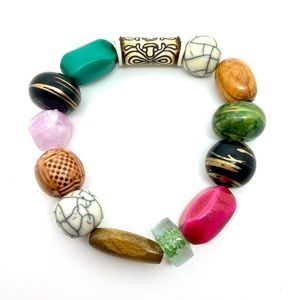Multicolor beaded bracelet. Each bead is different. Stretchy band.